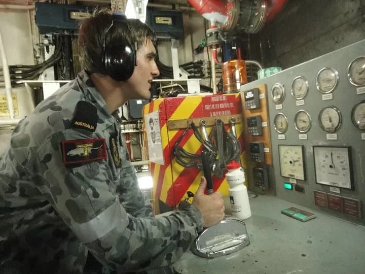 Mitchell Leeson at work as a Navy Marine Technician